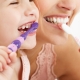 Mother and Daughter Brushing Teeth